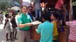 Rtn. Gautom Baruah offering foods in the Rotary Annadan Project