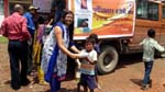Rtn. Indira distributing  foods to the childrens