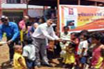Rtn. Tilak Raj Gulati distributing  foods to the childrens